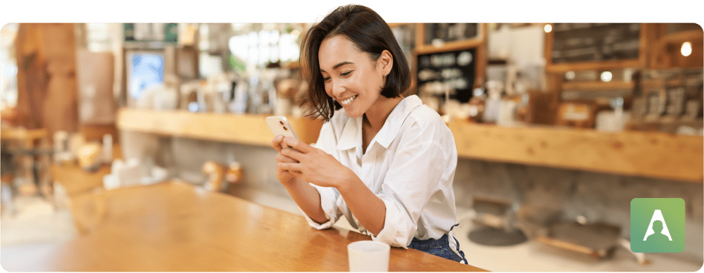 woman on phone in cafe